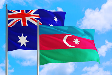 Azerbaijan and Australia national flag waving in the windy deep blue sky. Diplomacy and international relations concept.