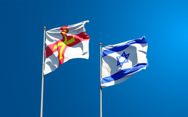 Beautiful national state flags of Guernsey and Israel together at the sky background. 3D artwork concept.