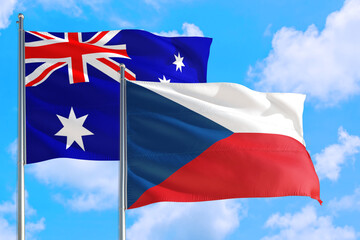 Czech Republic and Australia national flag waving in the windy deep blue sky. Diplomacy and international relations concept.