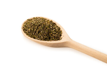 Oregano spice in wooden spoon isolated.