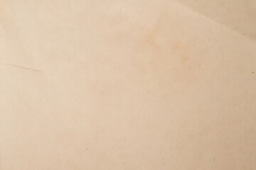 Old crumpled beige paper background.