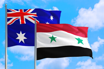 Syria and Australia national flag waving in the windy deep blue sky. Diplomacy and international relations concept.