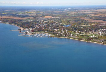 Aerial view from above Lake Erie towards the shoreline near the small town of Port Dover home of Friday the 13th biker meets, Autumn Season colors; Ontario Canada