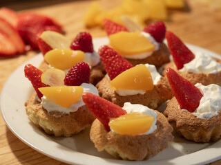 Strawberry, peach and whipped cream cupcakes