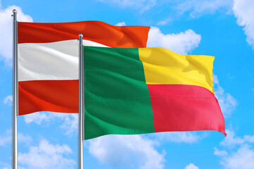 Benin and Austria national flag waving in the windy deep blue sky. Diplomacy and international relations concept.