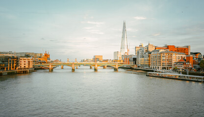 Obraz premium sunset over the London skyline, view from Millenium Bridge, UK