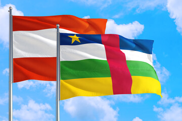 Central African Republic and Austria national flag waving in the windy deep blue sky. Diplomacy and international relations concept.