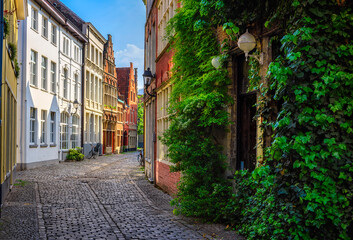 Fototapeta na wymiar Old narrow street in Ghent (Gent), Belgium. Architecture and landmark of Ghent. Cozy cityscape of Ghent.