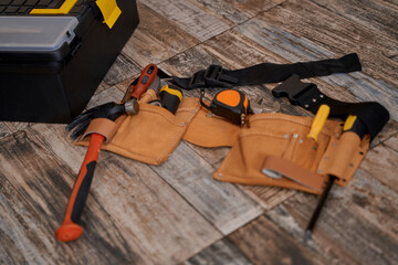 Belt with repair tools lying on floor