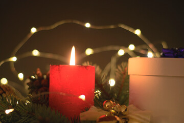 Red christmas candle with decorations. Christmas background