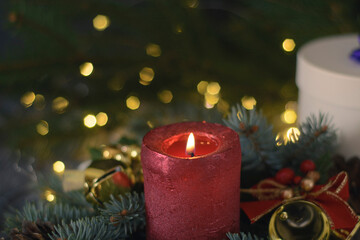 Red christmas candle with decorations. Christmas background