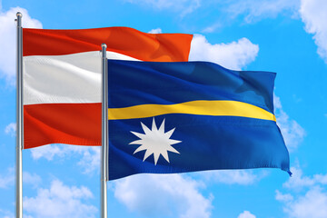 Nauru and Austria national flag waving in the windy deep blue sky. Diplomacy and international relations concept.