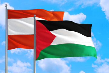 Palestine and Austria national flag waving in the windy deep blue sky. Diplomacy and international relations concept.