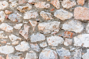 Antique stone wall. Old gray bricks background.