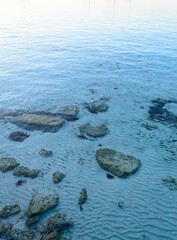 Cristal clear water at Cala Azzurra in Favignana, Italy. The bright blue color of the water gives the name to the place