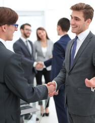 handshake of business partners after the briefing