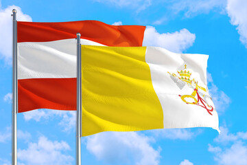 Vatican City and Austria national flag waving in the windy deep blue sky. Diplomacy and international relations concept.