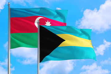 Bahamas and Azerbaijan national flag waving in the windy deep blue sky. Diplomacy and international relations concept.