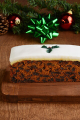 closeup fruit cake on wood cutting board