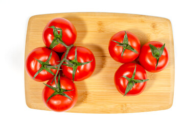 Cherry tomatoes, on a wooden cutting board. close-up