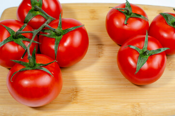 Cherry tomatoes, on a wooden cutting board. close-up