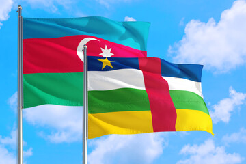 Central African Republic and Azerbaijan national flag waving in the windy deep blue sky. Diplomacy and international relations concept.