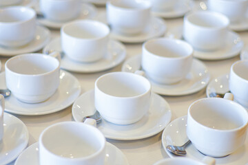 Fototapeta na wymiar Hot coffee cup row with spoon in hotel