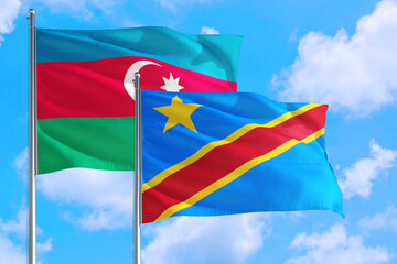 Congo and Azerbaijan national flag waving in the windy deep blue sky. Diplomacy and international relations concept.