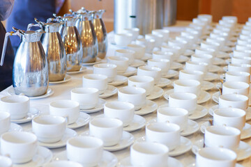 Hot coffee cup row with spoon in hotel