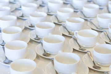 Hot coffee cup row with spoon in hotel