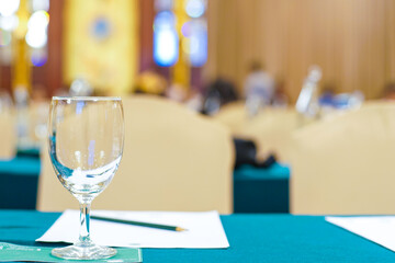 Drinkking water in wine glass on table of meeting room
