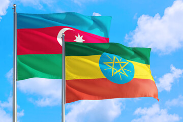 Ethiopia and Azerbaijan national flag waving in the windy deep blue sky. Diplomacy and international relations concept.