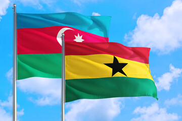 Ghana and Azerbaijan national flag waving in the windy deep blue sky. Diplomacy and international relations concept.