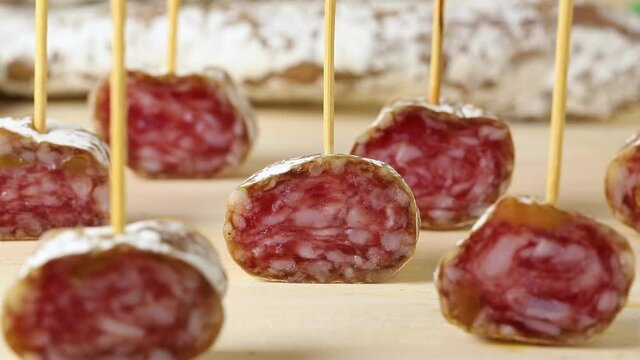 Slices of Spanish fuet Iberico, sausage, close up