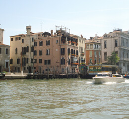 boats on the water among the houses