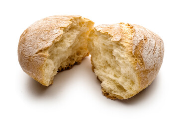 small empty loaf broken in two halves isolated with shadow on white background
