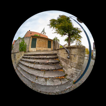 Old stairs of stone in front of a german church