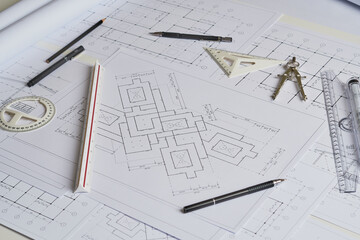 Architect engineer contractor design working drawing sketch plan blueprint and making architectural construction house building in architect studio.