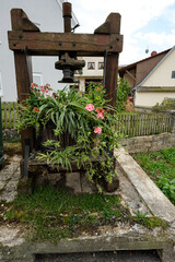 Old wooden grape press as flower pot