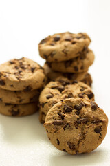 Stack of chocolate chip cookies on white background