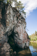 rock hanging over the river, rocky shore, peace and quiet in nature, white stone