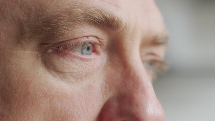 Old man's eyes closeup footage: pensive old man thoughtful elder