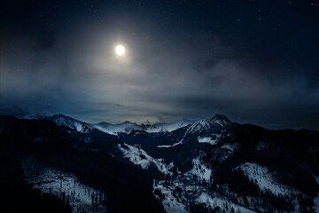 night view of the Polish Tatra Mountains and the moon