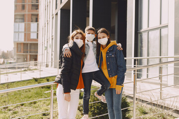 Family in a city. Person in a mask. Coronavirus theme.