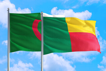 Benin and Algeria national flag waving in the windy deep blue sky. Diplomacy and international relations concept.