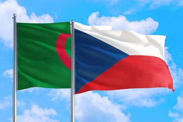 Fototapeta na wymiar Czech Republic and Algeria national flag waving in the windy deep blue sky. Diplomacy and international relations concept.