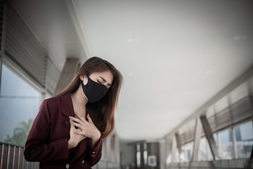 Asian woman wear face mask for protect COVID-19 virus,Thailand people,Young lady shortness of breath Coronavirus cough breathing problem