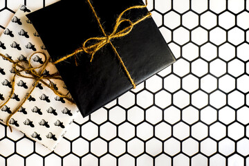 Aesthetic DIY Christmas/wedding gift boxes wrapped in white and black papers tied with vintage...