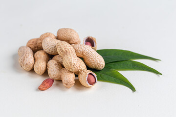 Peanuts. Contains beneficial vitamins and minerals. On a gray background.