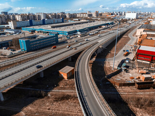 Fototapeta premium Aerial top view photo of highway multilevel junction road in urban populated area
